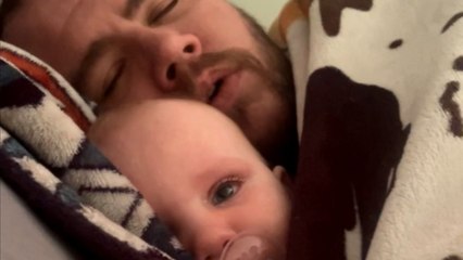 Woman films husband singing a Pirate Shanty to help baby fall asleep!