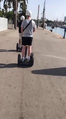 Guy Riding Segway Crashes Into Pole While Watching Fellow