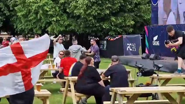 England fans watch the match action against Denmark at Sheffield fan park