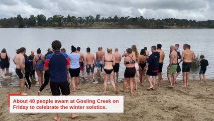 Brave swimmers jump into Gosling Creek for winter solstice