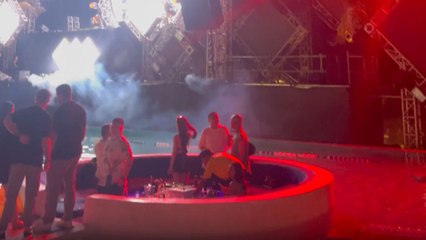 Woman unlocks new level of 'unbothered' by falling asleep at an outdoor music festival