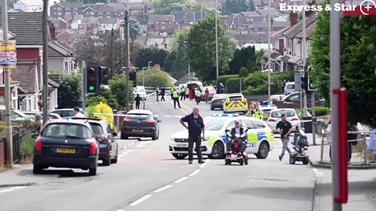 Police at the scene of a stabbing in Buffery Road, Dudley.