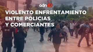 Enfrentamiento entre comerciantes y policías en Eje Central