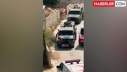 İsrail askerleri skandallara doymuyor! Yaralı Filistinliyi aracın önüne kalkan yaptılar