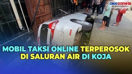 Tidak Mengetahui ada Saluran Air, Mobil Taksi Online Terperosok di Koja Jakarta Utara