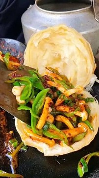 Chinese burger Sautéed mushrooms on stone plate