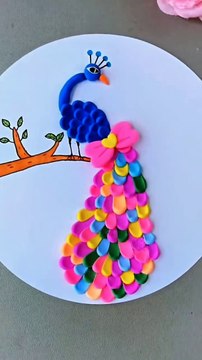 Crafted a vibrant canvas from simple materials, this clay crafted peacock transforming any space into a...on. .. Follow me for more- @itsy_bitsy_23 @itsy_bitsy_23 @itsy_bitsy_23..#CraftedBeauty #DIYArt #UpcycledCreations