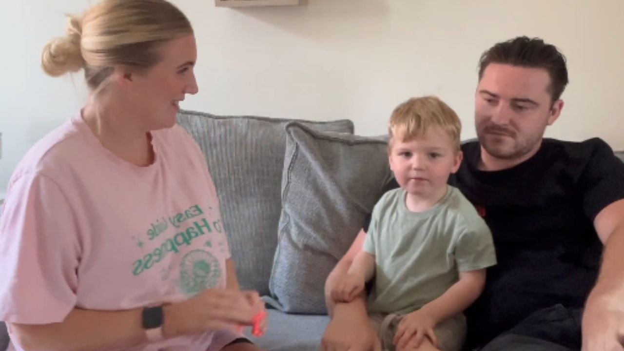 Parents involve excited toddler during intimate...