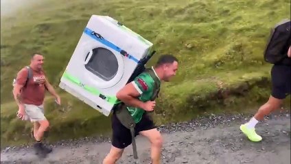 Builder climbs 3,500ft mountain carrying tumble dryer on back