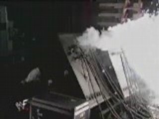WWE - The Rock Throws Mick Foley onto Explosives