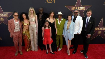 The cast of "MaXXXIne" poses together at the world premiere of the movie in Los Angeles