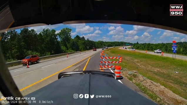 Gravel hauler slams into road crew near Lansing