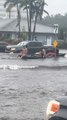 Trio Rides Boat on Flooded Street of Florida After Heavy Rainfall