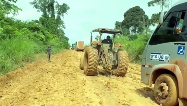 Bus stuck in deep mud road, Tractor stuck out the bus