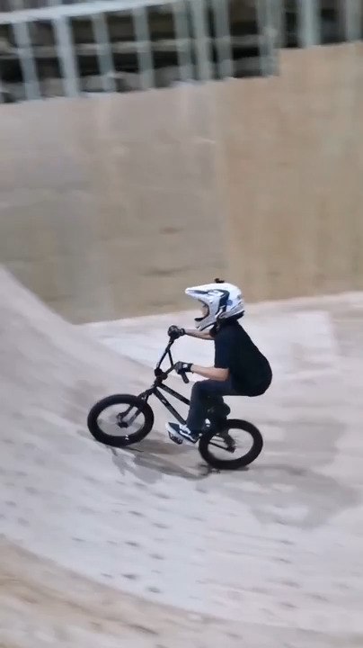 Boy Executes Double Bar Spin Trick on BMX After Several Failed Attempts