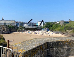 Watch a Chinook CH47 military helicopter fly-over Tenby's iconic St Catherine's Island and beaches