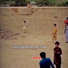 Small boy doing blowing