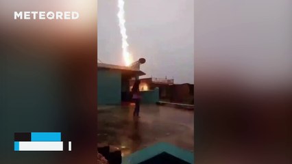 Lightning strikes very close to a girl in Sitamarhi, India