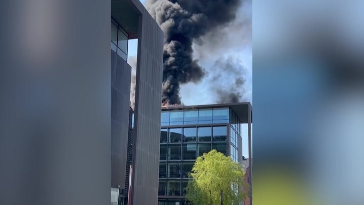 Smoke rises above Copenhagen as Denmark’s taxation ministry evacuated after fire