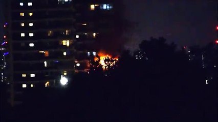 Fire tears through 10th floor flat in Woolwich Credit: @AJBC_1