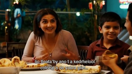 The camera shifts to a FAMILY at another table