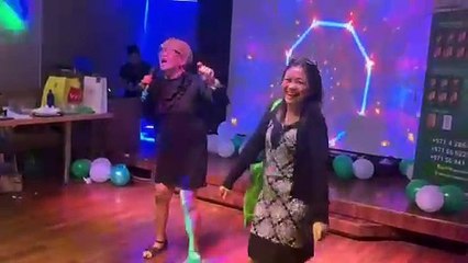 Members of Filipino Kasambahay Club sing and dance