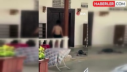 Edremit'te cami önünde kıyafetlerini çıkaran kadın hakkında polis işlem yaptı