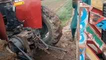 2 tractor are pulling heavy loaded trolley