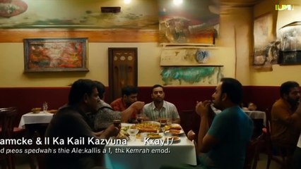 The camera pans over a bustling small restaurant in Karachi.