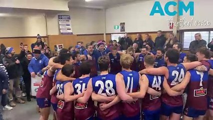 Horsham Demons senior footballers sing the club song after round 10 of the WFNL