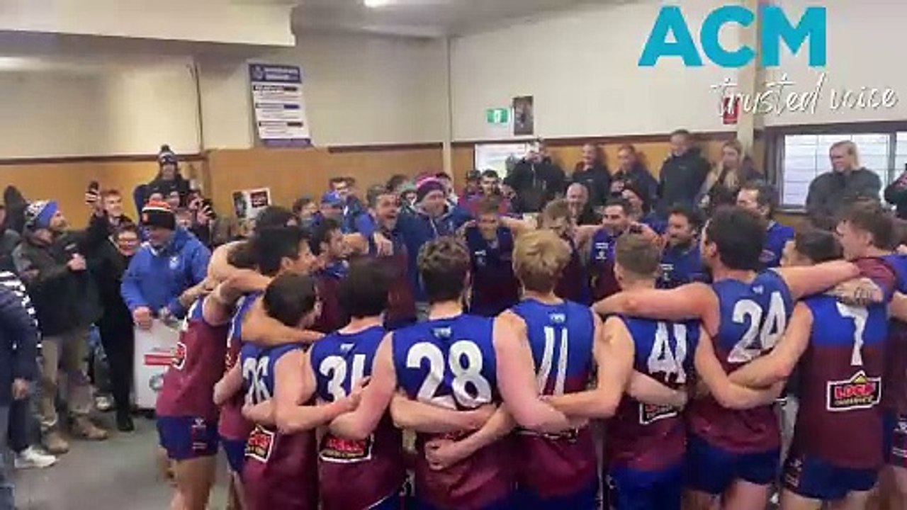 Horsham Demons senior footballers sing the club song after round 10 of the WFNL