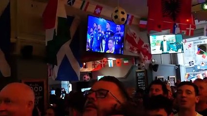 Scotland fans singing national anthem at Edinburgh pub