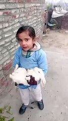 Cute baby playing with rabbit