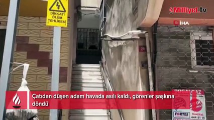 Çatıdan düşen adam havada asılı kaldı