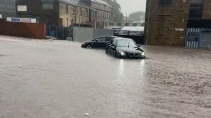 Cars soaked in floodwater during intense flooding in Bradford