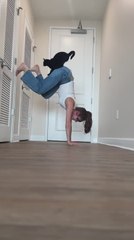 Cat Jumps on Woman Performing Handstand