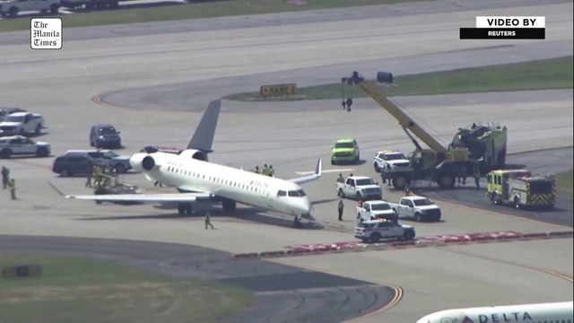 Aerials show Delta jet with damaged tail after taxiing accident