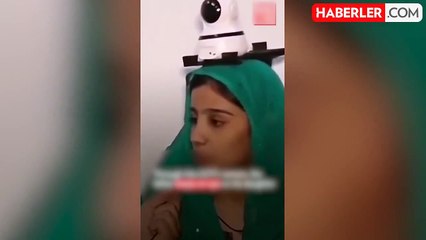 Pakistan'da kızının güvenliğinden endişe eden baba, kızının kafasın güvenlik kamerası taktırdı