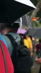 Punggol residents braved the rain to catch a glimpse of the Pope's arrival at the St Francis Xavier Retreat Centre.