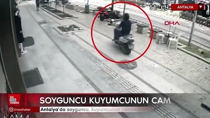 Antalya'da soyguncu, kuyumcunun camını taşla kırmaya çalıştı