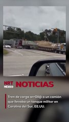El camión, que llevaba un tanque en un remolque bajo, quedó atrapado en las vías antes de ser embestido por el tren