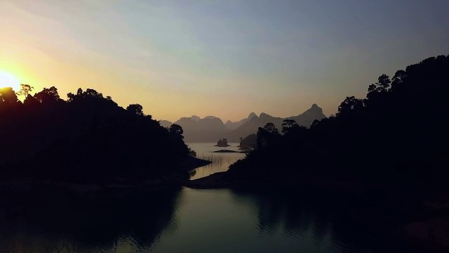 mixkit-landscape-of-a-large-lake-during-sunset-from-the-air-4998-hd-ready