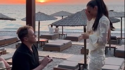 Wave of love: Man proposes to his girlfriend under the setting sun