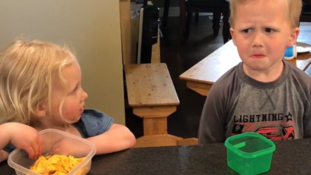 Little girl shares her meal with her brother in the 'Sharing Challenge'