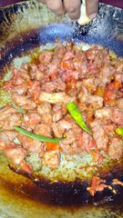 Eating tikka karahi at Dua Restaurant