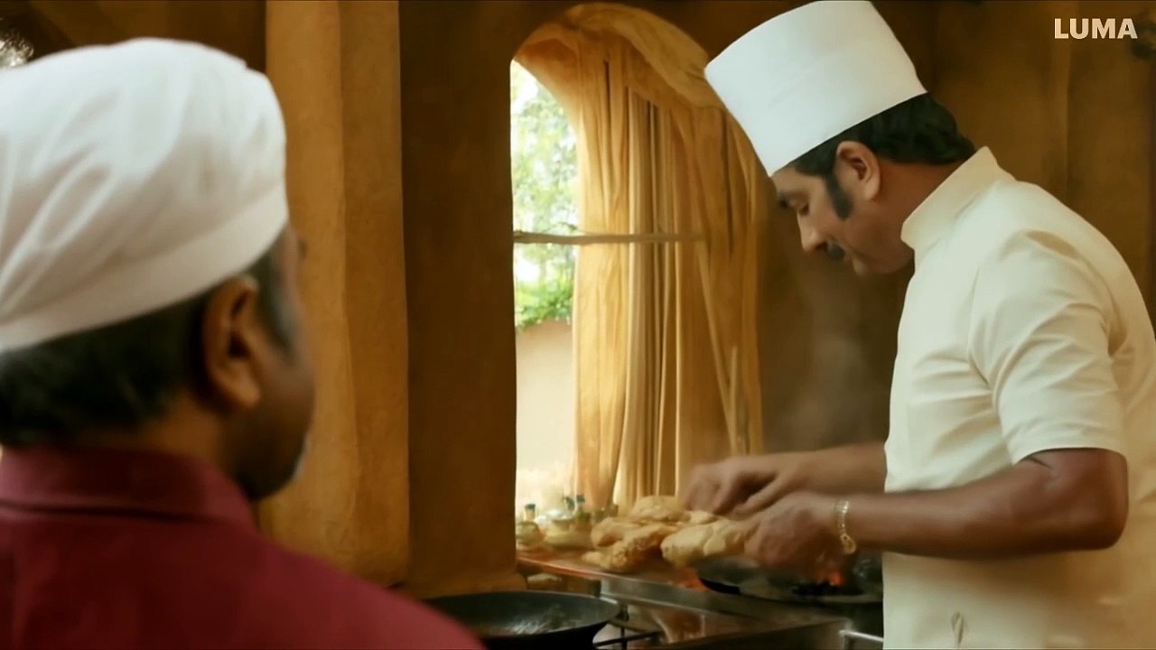 Cut to the kitchen where a middle-aged CHEF,