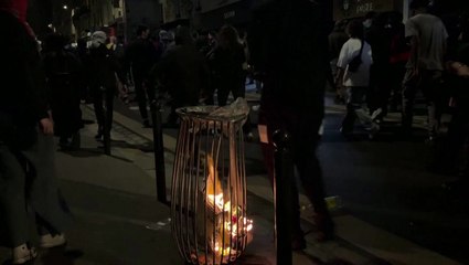 French protesters set off fireworks and damage Paris storefront after far-right election result