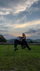 Two Friends Fall Hilariously While Posing on Fence
