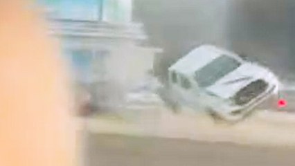 Mini tornado sends truck flying into oncoming traffic