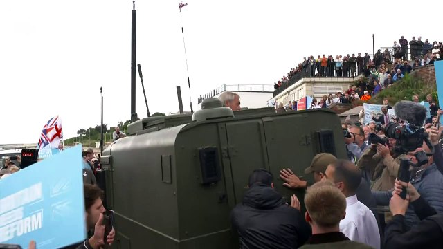 Nigel Farage addresses crowd from an army vehicle